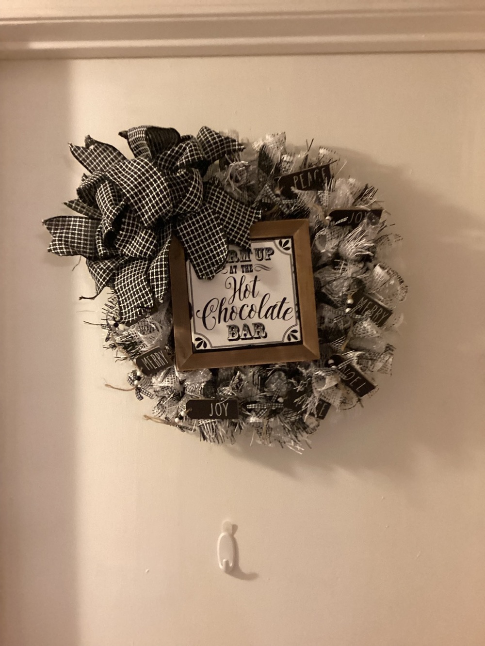 Homemade Christmas wreath with hot chocolate plaque